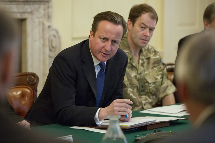 Britain's Prime Minister David Cameron (L) speaks during a Cobra meeting. (Reuters/Neil Hall)