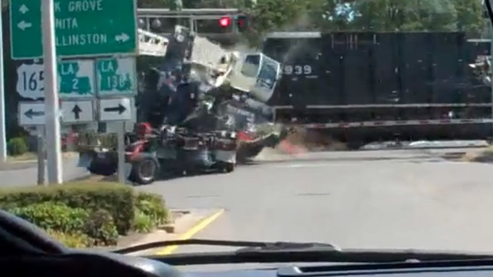 Unbelievably no casualties after locomotive slams into truck at full speed (VIDEO)