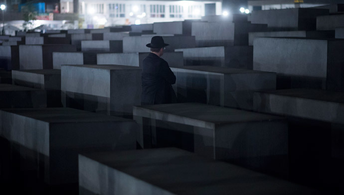 A Rabbi stands in front of a cement stele of the Holocaust Memorial to the Murdered Jews of Europe during a march from the Brandenburg Gate in Berlin. (AFP Photo / Johannes Eisele)