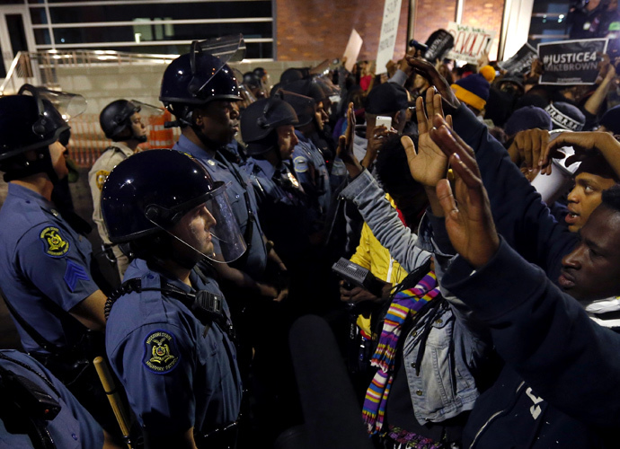 Protesters stand-off against police during a protest in Ferguson, Missouri October 10, 2014. (Reuters / Jim Young)