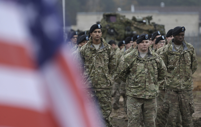 U.S, soldiers deployed in Latvia with the 1st Cavalry Division 1st Brigade Combat team, attend a rotation ceremony at Adazi military base October 14, 2014. (Reuters/Ints Kalnins)
