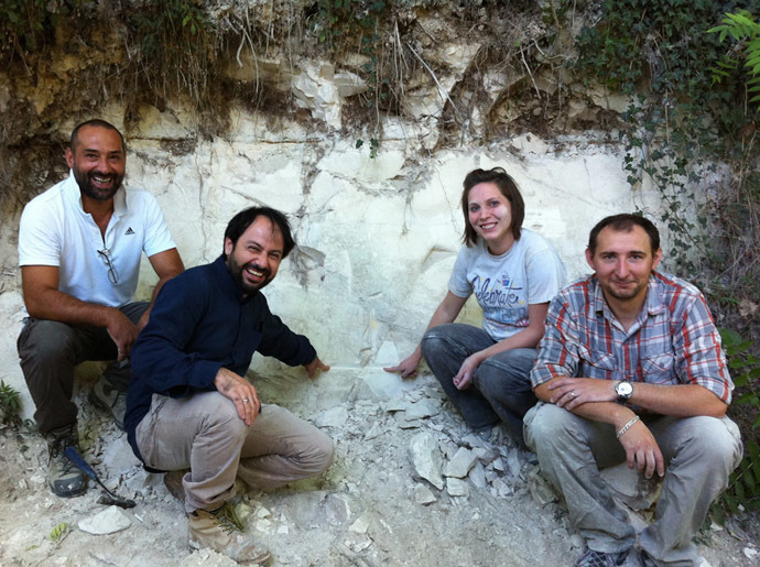 The international team of scientists sitting next to an outcrop in the Sulmona basin of the Apennine Mountains that contains the Matuyama-Brunhes magnetic reversal. (Photo by Paul Renne, from press-release of the University of California, Berkeley)