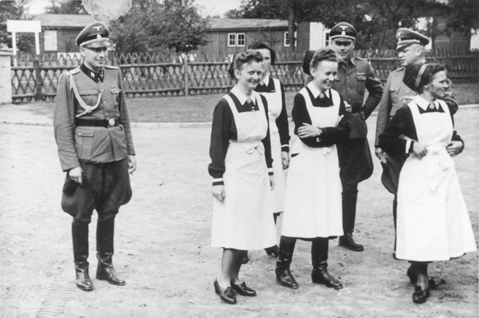 This 01 September 1944 photo shows SS officers and German nurses as they gather during the dedication ceremony of the new SS hospital in Auschwitz. (AFP Photo / Holocaust Memorial Museum) 