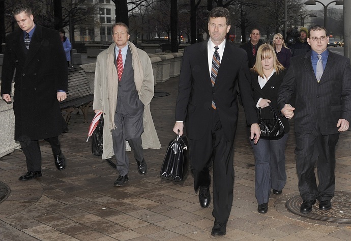 Former Blackwater Worldwide security guards Donald Ball (2nd L) and Dustin Heard (R) leave the federal courthouse with their legal team after being arraigned (Reuters/Jonathan Ernst)
