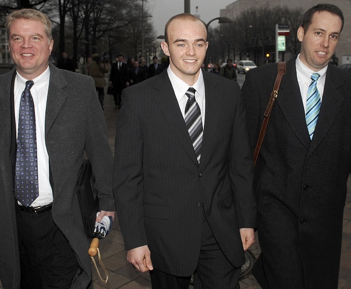 Former Blackwater Worldwide security guard Nick Slatten (C) and attorneys after he was arraigned (Reuters/Jonathan Ernst/Files)