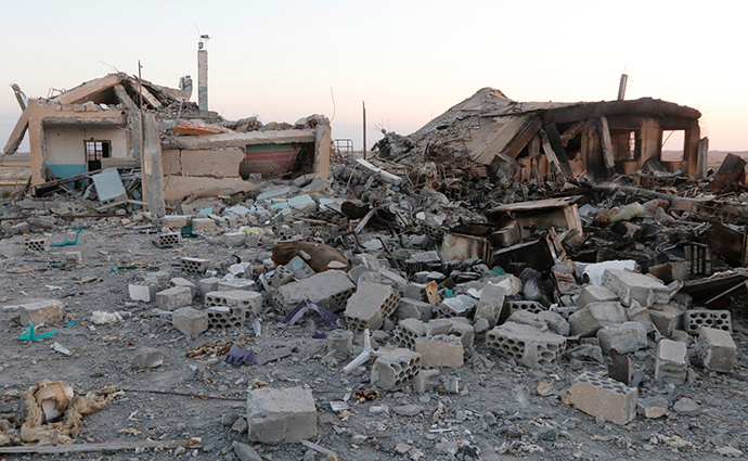 A general view shows a damaged school that was targeted on Monday by what activists said were U.S.-led air strikes, at Ain al-Arous town in Raqqa governorate October 1, 2014 (Reuters / Stringer)