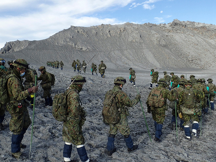Japan Self-Defense Force (JSDF) soldiers conduct rescue operations near the peak of the Mount Ontake, which erupted September 27, 2014 and straddles Nagano and Gifu prefectures, central Japan, in this handout photograph released by Joint Staff of the Defence Ministry of Japan and taken October 11, 2014 (Reuters / Joint Staff of the Defence Ministry of Japan)