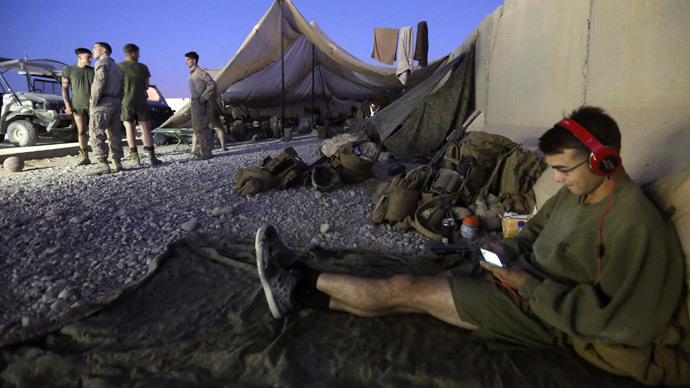 A U.S. Marine listens to music before their withdrawal from the base, at Camp Bastion in Helmand province October 25, 2014.(Reuters / Omar Sobhani)