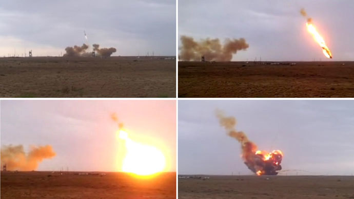 The Proton-M carrier-rocket with its DM-03 upper stage and three Russian Glonass-M satellite navigation systems seen falling down after its take-off from the Baikonur space center. Composition of four photos.(RIA Novosti / Yuri Aliseenko)