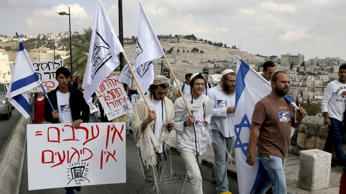 Israeli right-wing activists demonstrate over the closure of the al-Aqsa mosque compound, Islam's third holiest site, but also the most sacred spot for Jews who refer to it as the Temple Mount because it once housed a Jewish temple in the old city of Jerusalem, on October 30, 2014 after Israeli authorities temporarily closed the compound. (AFP Photo/Gali Tibbon)