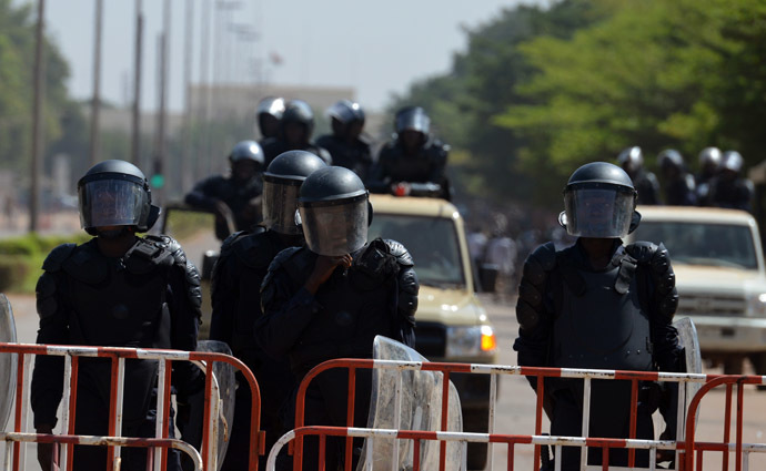 Riot police cordon off access to the parliament on October 29, 2014 in Ouagadougou as people demonstrate against the high cost of living in Burkina Faso. (AFP Photo/Issouf Sango)