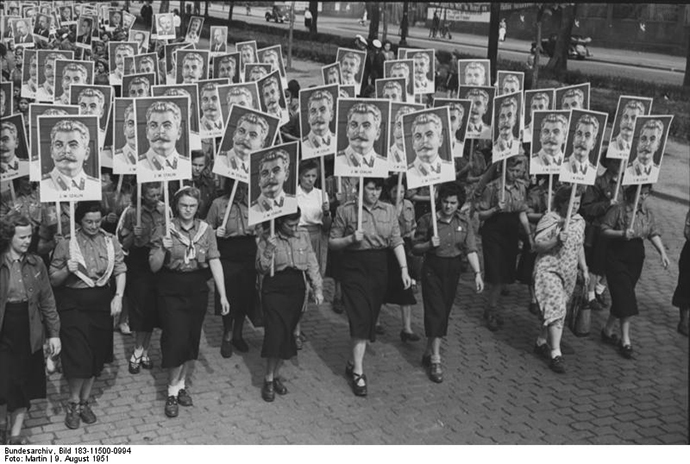 German students carry posters of Joseph Stalin for a youth parade in 1951 (image from wikimedia.org)