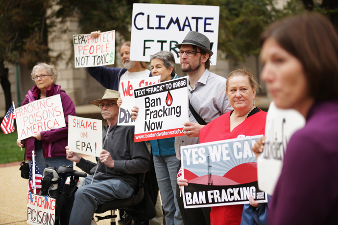 Affected community members from Dimock, Pennsylvania hold signs during a rally on fracking-related water investigations October 10, 2014 outside EPAs Headquarters in Washington, DC. (Alex Wong / Getty Images / AFP)