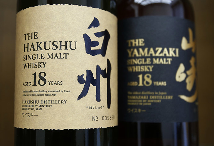 Bottles of Suntory Holding's Yamazaki (R) and Hakushu whiskies are displayed at Suntory World Headquarters in Tokyo. (Reuters/Issei Kato)