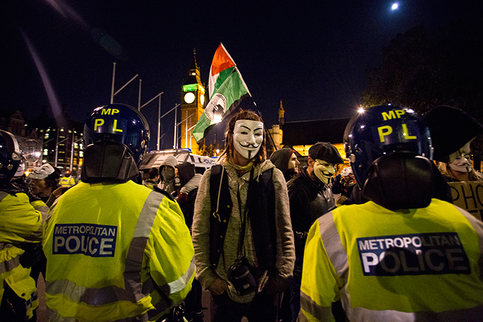 Anti-capitalist protesters wearing Guy Fawkes masks take part in the "Million Masks March" in Parliament Square in London on November 5, 2014. (AFP Photo / Jack Taylor)