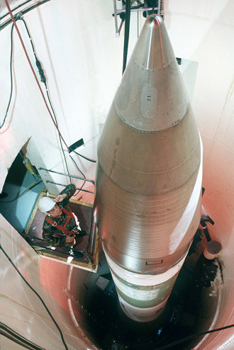 This US Air Force handout file image shows an Air Force technician inspecting an LGM-30G Minuteman III missile inside a silo about 60 miles from Grand Forks Air Force Base, in North Dakota. (AFP Photo/US Air Force)