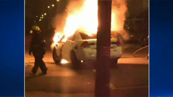High school firefighter rescues cop from burning cruiser (VIDEO)