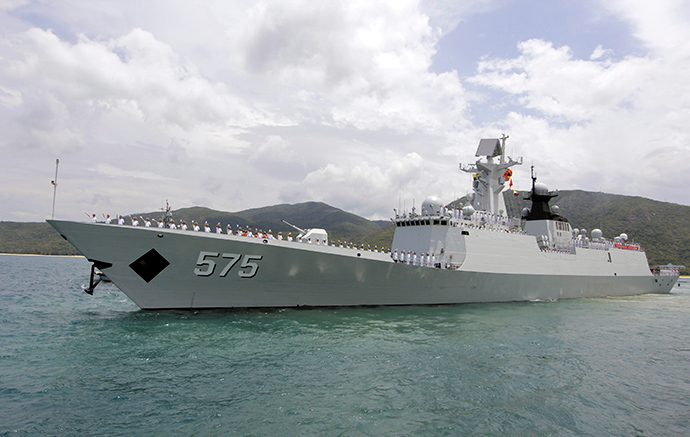 Chinese navy sailors wave as Chinese naval missile frigate Yueyang departs for the Rim of the Pacific exercise (RIMPAC), at a military port in Sanya, Hainan province June 9, 2014 (Reuters / Stringer)
