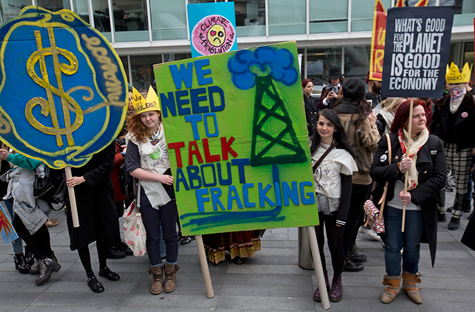 Demonstrators hold banners during an anti-fracking protest in central London (Reuters / Neil Hall)