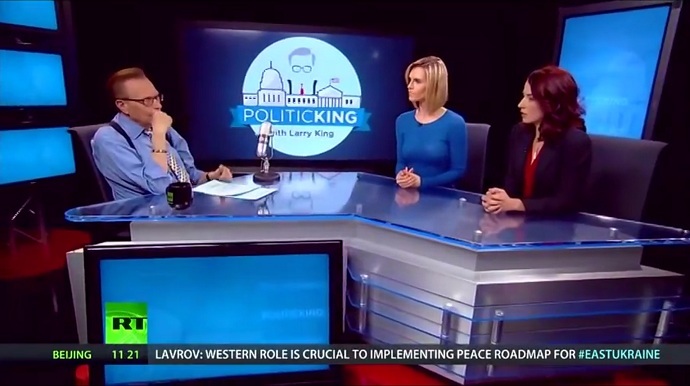 Larry King interviews hosts Erin Ade and Abby Martin on Politicking, which airs on RT America (screenshot from youtube.com/rtamerica)