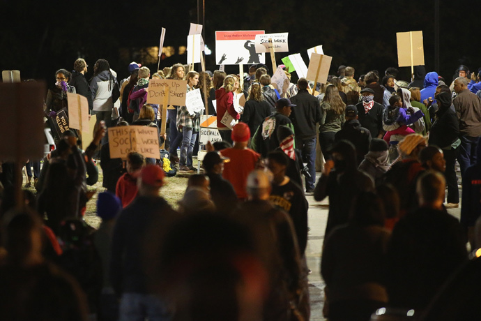 Police face off with demonstrators as protests continue in the wake of 18-year-old Michael Brown's death on October 22, 2014 in Ferguson, Missouri. (Scott Olson / Getty Images / AFP)