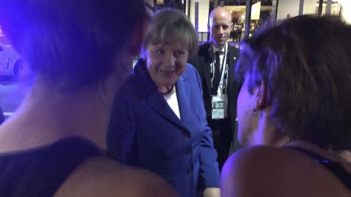Party frau: Merkel spotted mingling with pub drinker on first G20 night