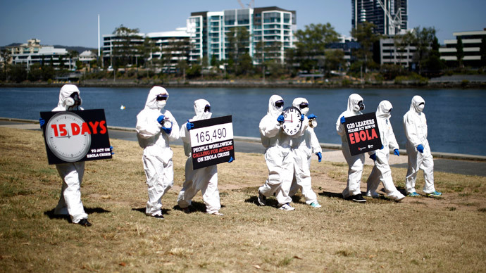 Aid workers and protesters dressed in protective equipment demonstrate, calling for for G20 leaders to address the Ebola issue, near the G20 leaders summit venue in Brisbane November 15, 2014.(Reuters / Jason Reed)