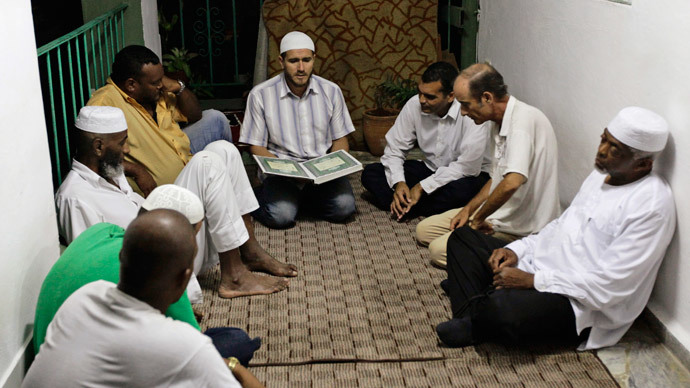 Cuban Muslims listen to verses from the Koran after their Iftar (fast-breaking) meal during the Islamic holy month of Ramadan in Havana.(Reuters / Desmond Boylan)