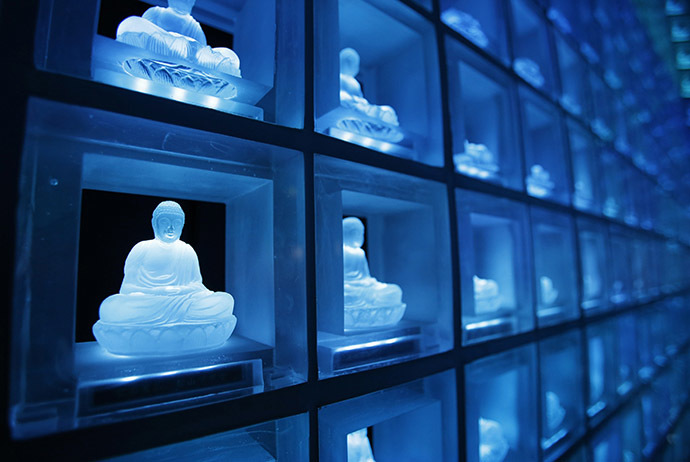 Buddha statues carved in crystals are pictured at the "Ruriden", a cemetery that uses high-powered LED lights to illuminate over 2,000 Buddha statues, in downtown Tokyo October 27, 2014. (Reuters/Toru Hanai)