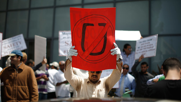 Commercial drivers with the app-based, ride-sharing company Uber protest against working conditions outside the company's office in Santa Monica, California June 24, 2014.(Reuters / Lucy Nicholson)