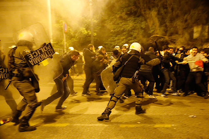 Riot policemen clash with protesters at a rally marking the 41st anniversary of a 1973 student uprising against a U.S. backed military dictatorship in then ruling Greece, near the U.S. embassy in Athens November 17, 2014. (Reuters / Yannis Behrakis)