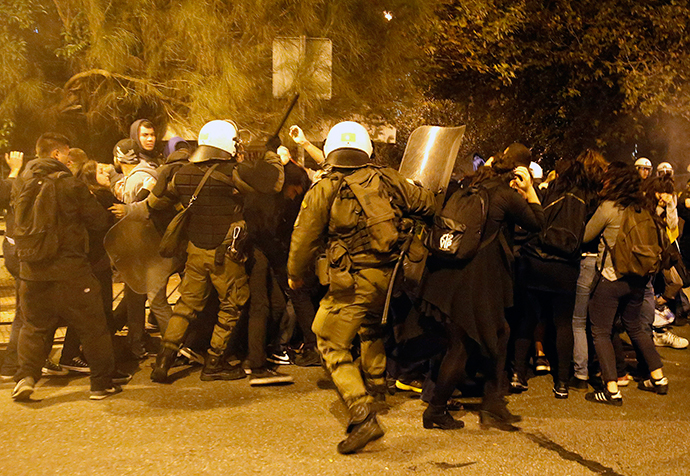 Riot policemen clash with protesters at a rally marking the 41st anniversary of a 1973 student uprising against a U.S. backed military dictatorship in then ruling Greece, near the U.S. embassy in Athens November 17, 2014. (Reuters / Yannis Behrakis)
