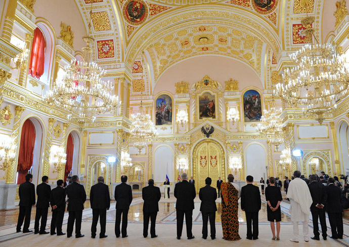 President Vladimir Putin, center, speaks during the ceremony of presenting credentials from new foreign ambassadors in the Grand Kremlin Palace's Alexander Hall. (RIA Novosti/Michael Klimentyev)