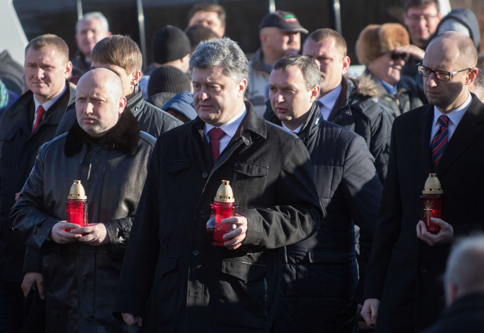 L-R: Chairman of the Verkhovna Rada Oleksandr Turchynov, Ukrainian President Petro Poroshenko and Prime Minister Arseniy Yatsenyuk during the ceremony of laying flowers to the Celestial Hundred Heroes Cross on the anniversary of the beginning of Maidan protests. (RIA Novosti / Mikhail Markiv) 