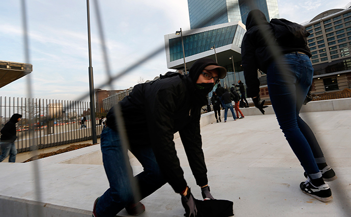 2014Blockupy protesters break through fences in front of the new European Central Bank (ECB) headquarters during a demonstration in Frankfurt November 22, 2014 (Reuters / Kai Pfaffenbach)