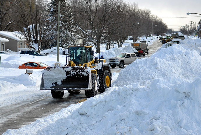  A High Loader works to clear snow along McKinley Park Avenue on November 20, 2014 in the suburb of Blasdell, Buffalo, New York. (AFP Photo/John Normile)