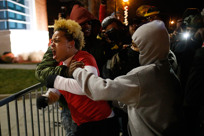 A woman approaches the barricade to confront the police outside the Ferguson Police Department in Ferguson, Missouri, November 24, 2014 (Reuters / Adrees Latif)