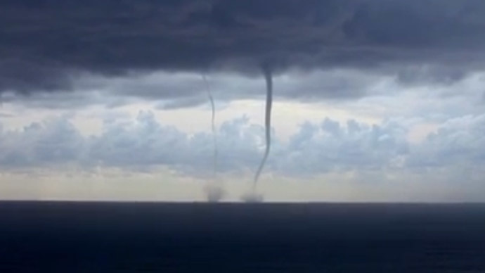 Wet waltz: Rare twin waterspouts elegantly dance off Italian coast (VIDEO)