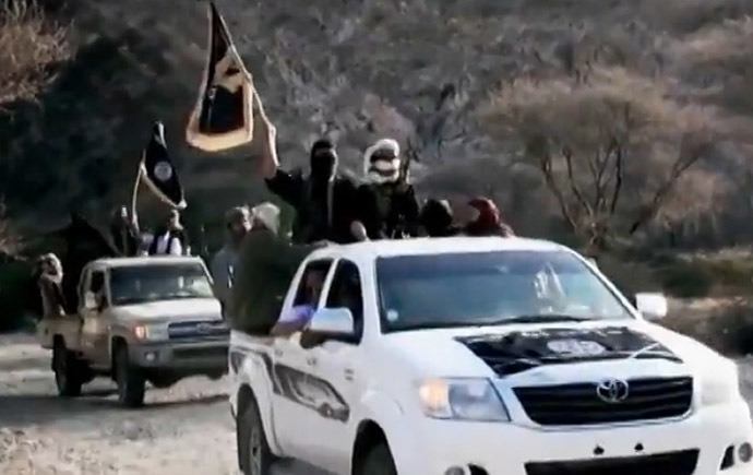 An image grab taken on April 16, 2014 from a video released on March 29, 2014 by Al-Malahem Media, the media arm of Al-Qaeda in the Arabian Peninsula (AQAP), allegedly shows AQAP jihadists arriving at a meeting with their chief Nasser al-Wuhayshi at an undisclosed location in Yemen. (AFP Photo/HO/Al-Malahem Media)