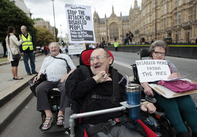 Disabled people demonstrate during "The Hardest Hit" march, as they protest against cutbacks to local services and government disability allowance spending cuts, London May 11, 2011. (Reuters/Olivia Harris)