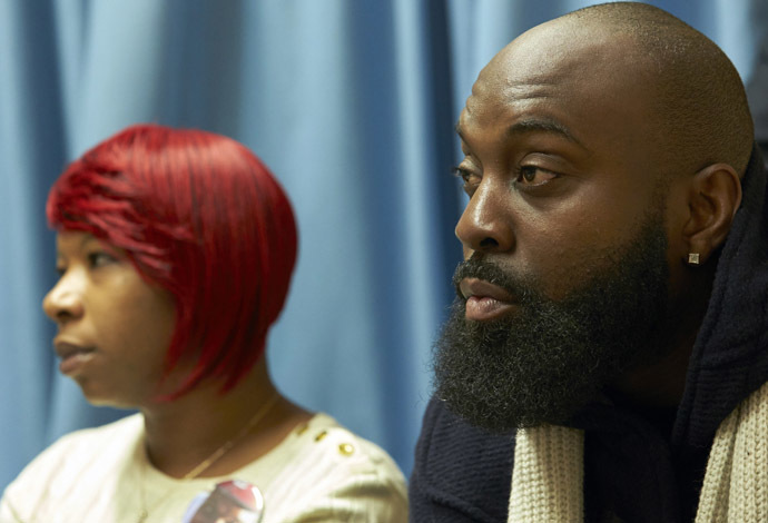 The mother, Lesley McSpadden (L) and father, Michael Brown Sr., of slain teenager Michael Brown, hold a news conference in Geneva November 12, 2014. (Reuters/Denis Balibouse)