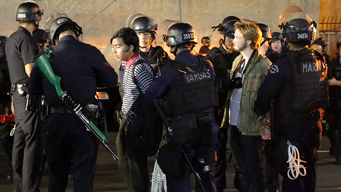 Two men are detained before being released with a warning by the LAPD during a demonstration against the grand jury's decision in the Ferguson, Missouri shooting of Michael Brown, in Los Angeles, California November 28, 2014 (Reuters / Jonathan Alcorn)