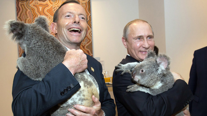 Australia's Prime Minister Tony Abbott (L) and Russia's President Vladimir Putin as they meet Koalas before the start of the first G20 meeting in Brisbane.(AFP Photo / Andrew Taylo)