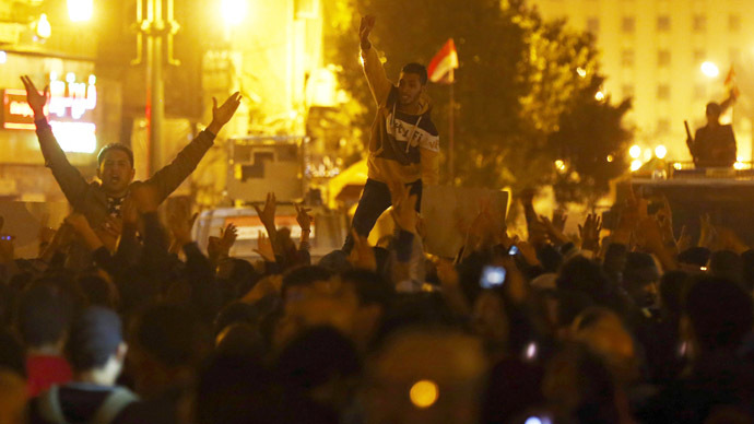 Anti-Mubarak protesters shout slogans against government and military rules after the verdict of former Egyptian President Hosni Mubarak's trial, around Abdel Moneim Riad square in downtown Cairo November 29, 2014. (Reuters/Amr Abdallah Dalsh)