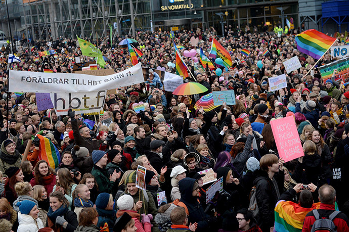 Supporters of the same-sex marriage celebrate outside the Finnish Parliament in Helsinki, Finland on November 28, 2014 after the Finnish parliament approved a bill allowing homosexual marriage. (AFP Photo/Lehtikuva)