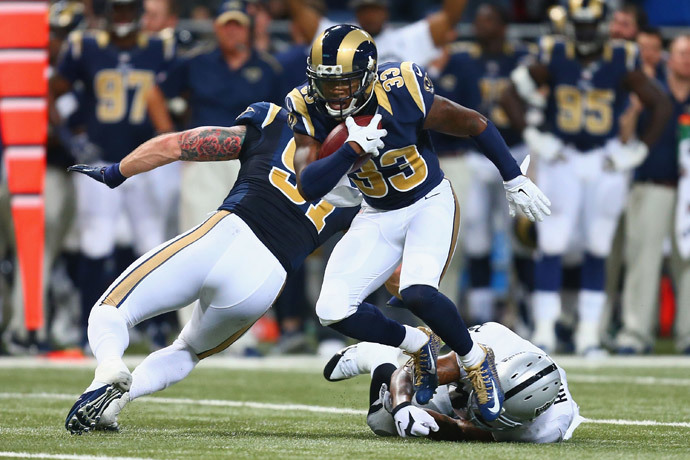 E.J. Gaines #33 of the St. Louis Rams returns an interception against the Oakland Raiders in the second quarter at the Edward Jones Dome on November 30, 2014 in St. Louis, Missouri. (Dilip Vishwanat / Getty Images / AFP)