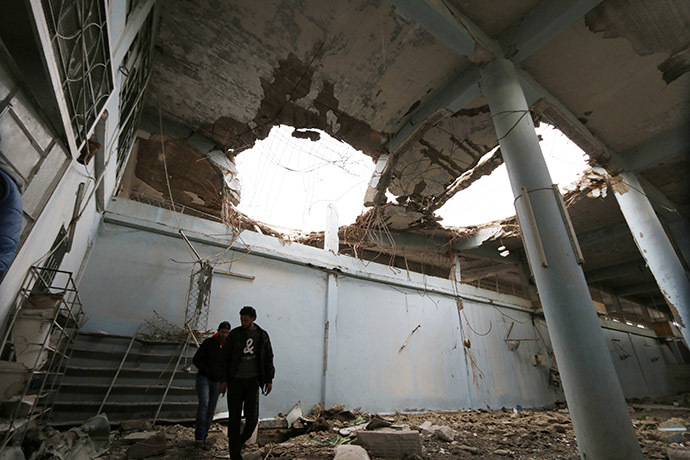 Men inspect the damage inside the ancient Grand Mosque in Maaret al-Naaman town in Idlib province November 27, 2014. (Reuters/Khalil Ashawi)