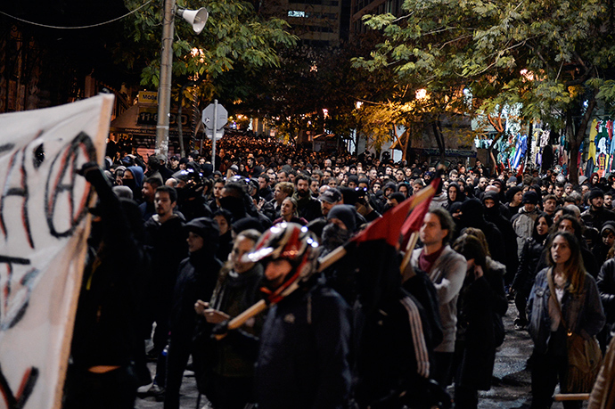Thousands march in central Athens on December 2, 2014 during a massive march in solidarity with a 22-years old anarchist hunger striker, Nikos Romanos (AFP Photo / Louisa Gouliamaki)