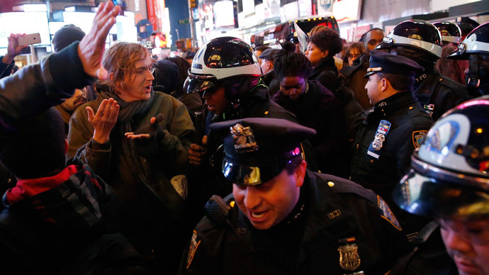 Demonstrators clash with police as they fill the streets in Times Square as they protest a grand jury decision not to charge a New York policeman in the choking death of Eric Garner, in New York December 4, 2014.(Reuters / Shannon Stapleton)