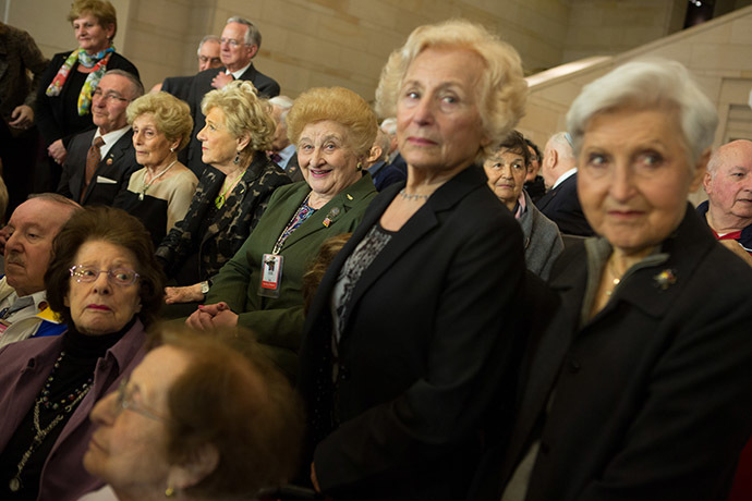 Holocaust survivors who volunteer at the U.S. Holocaust Museum pose for a photo after the National Commemoration of the Days of Remembrance honoring the victims of the Holocaust and Nazi persecution at the U.S. Capitol building in Washington D.C. (AFP Photo/Allison Shelley)